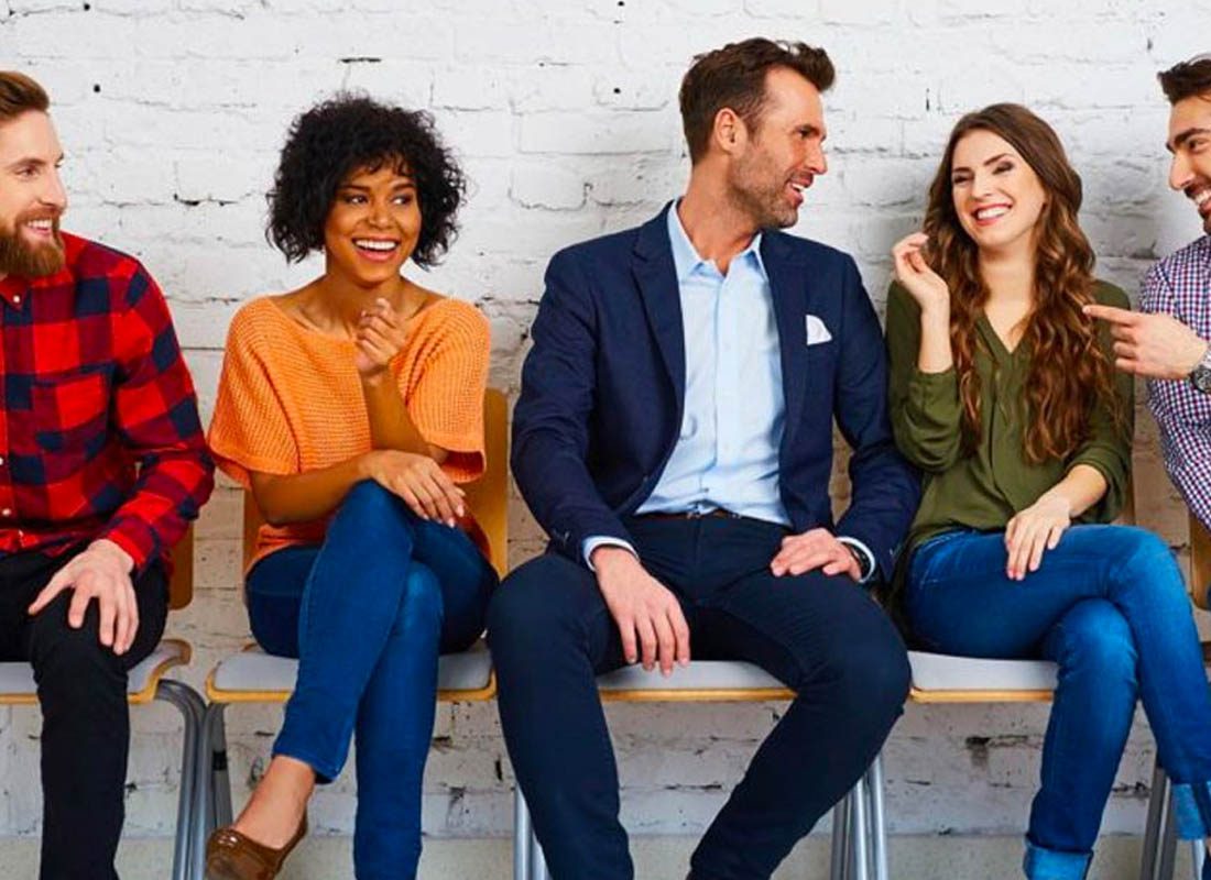 Keystone Partnership - Happy Employees Sitting on a Bench at Work