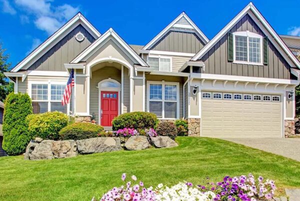 Blog - Family Home with a Red Door and American Flag Outside