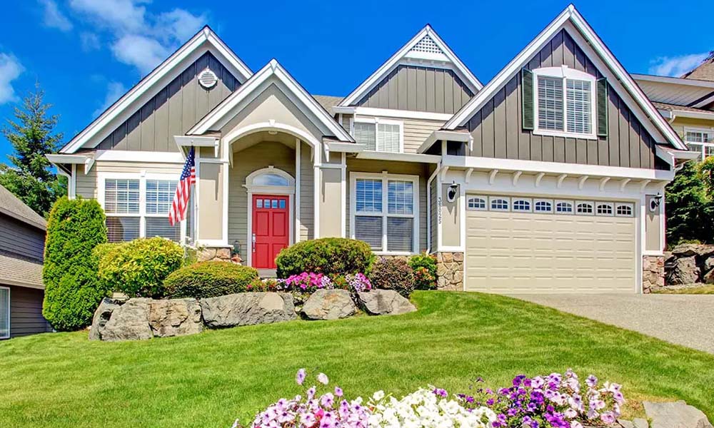 Blog - Family Home with a Red Door and American Flag Outside